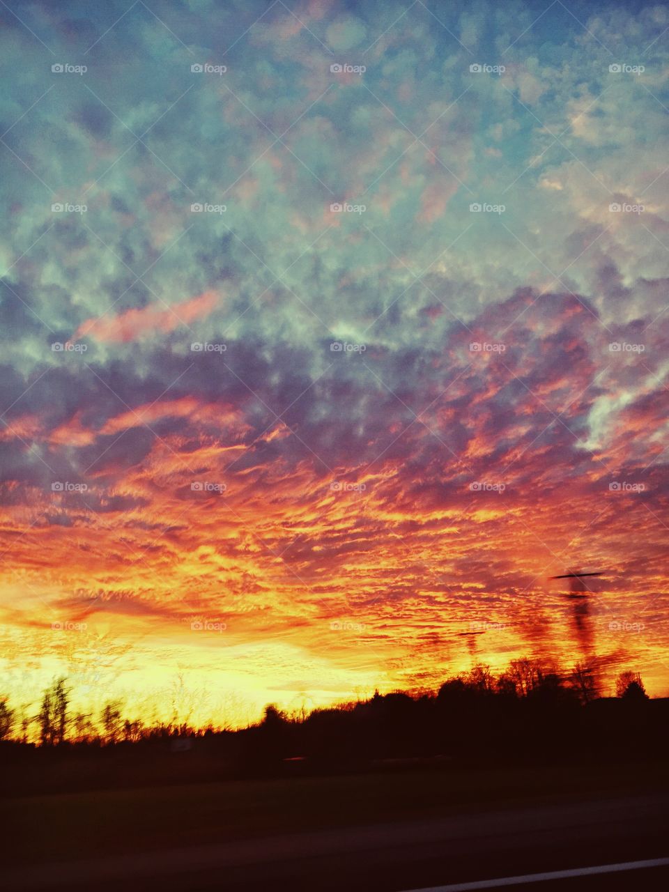 Sunset down an Indiana highway