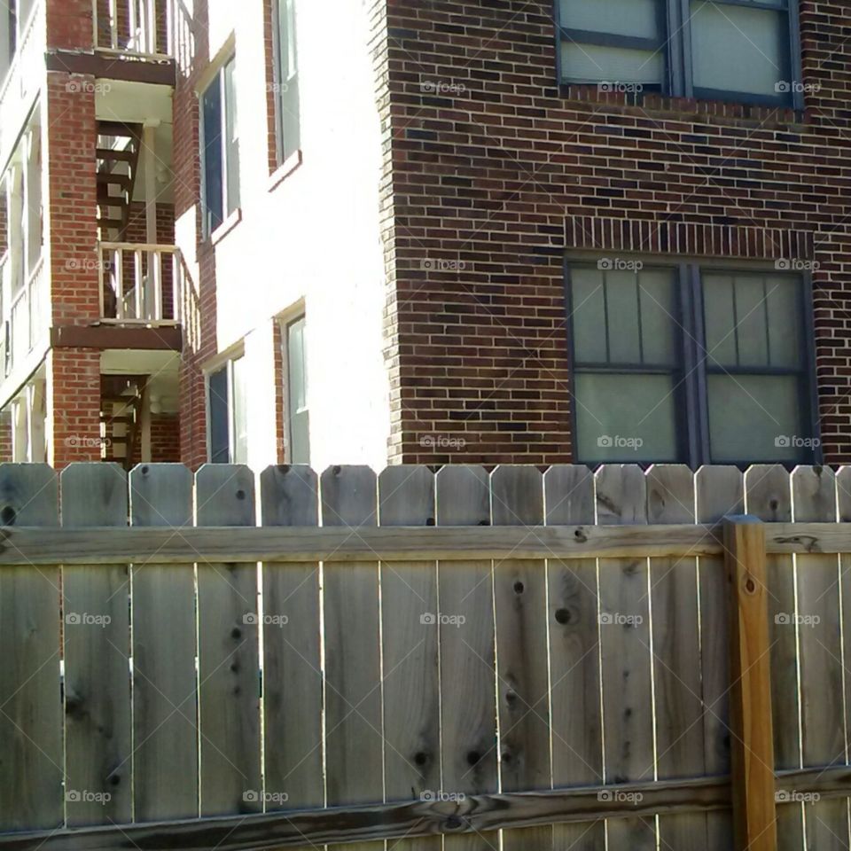 apartment building and fence