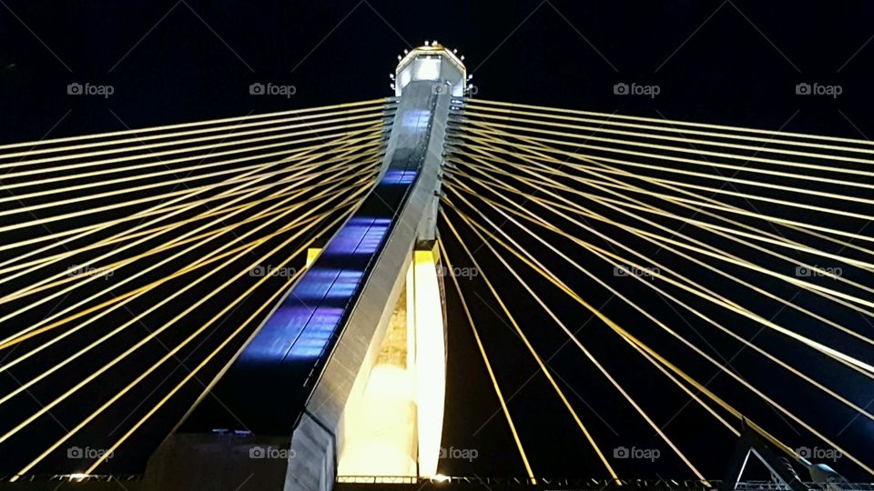 Night at Cable Suspension Bridge across the Chao Phraya River. Bangkok. Thailand.