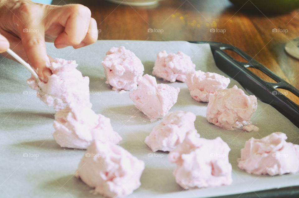 Woman making meringues