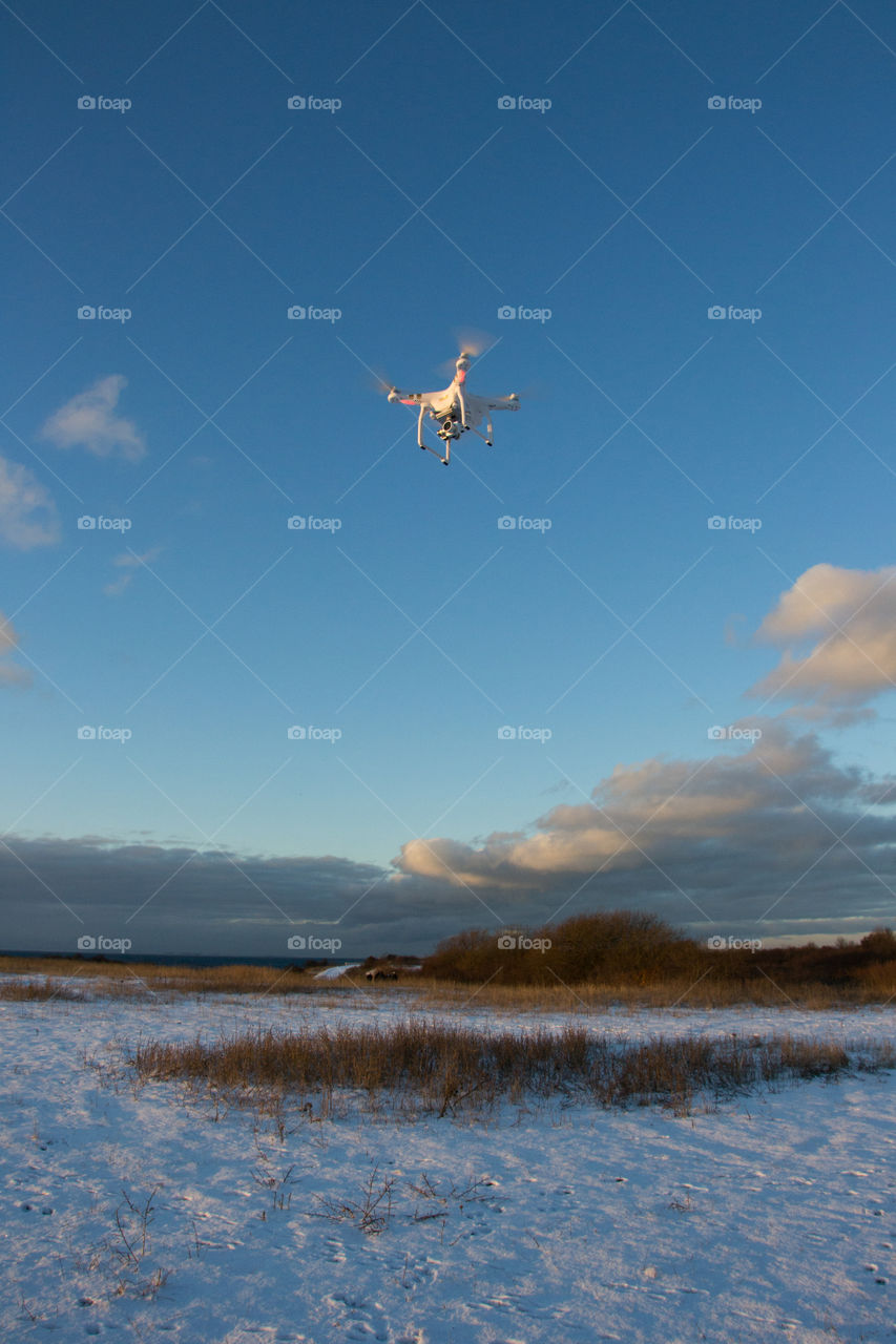 Phantom drone in the air taking pictures.