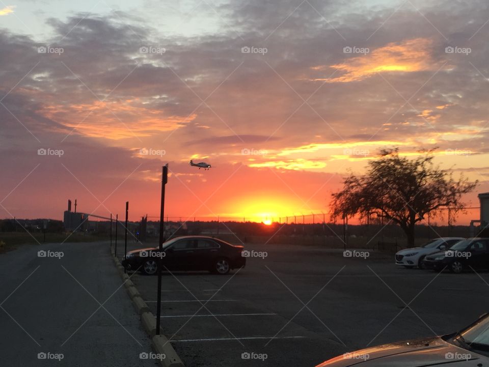 Plane landing at sunrise 
