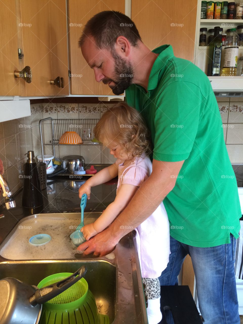 Daughter helping father in house work