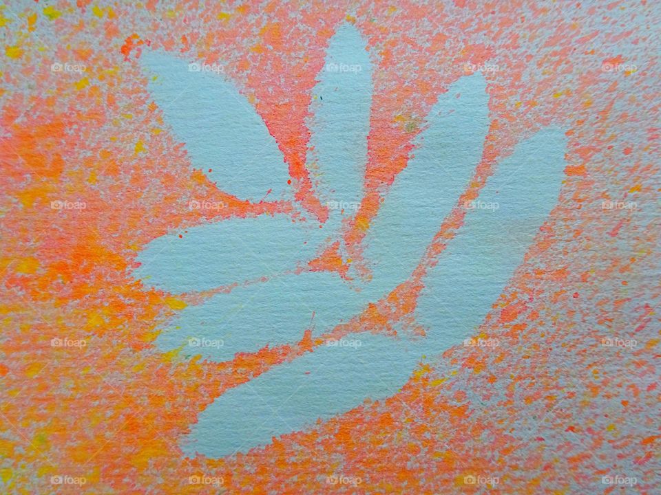 Rowan tree leaf silhouette on textured paper with abstract colored watercolor drawing