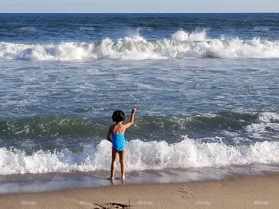 Big waves, small girl