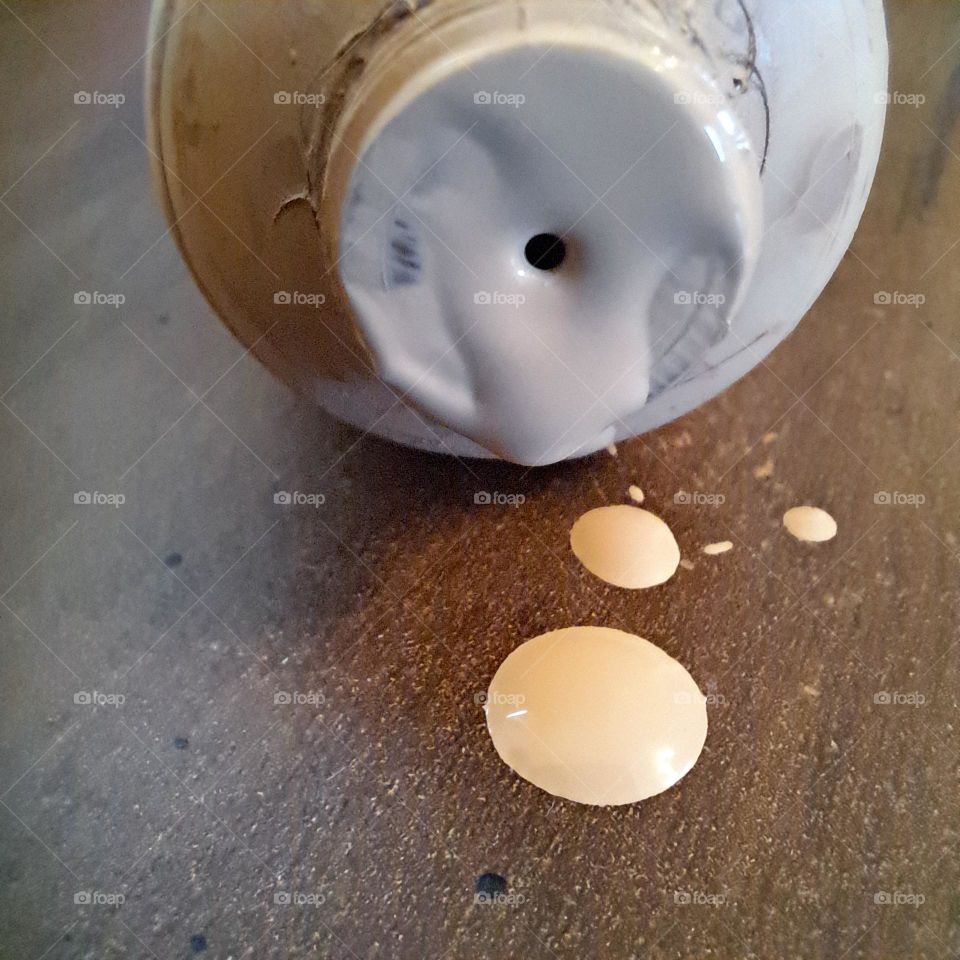 foundation makeup. tube. spillage. droplets