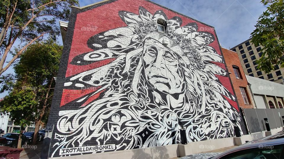 Irot Street Art Native American Mural on Webster Street Oakland California. Landscape view.