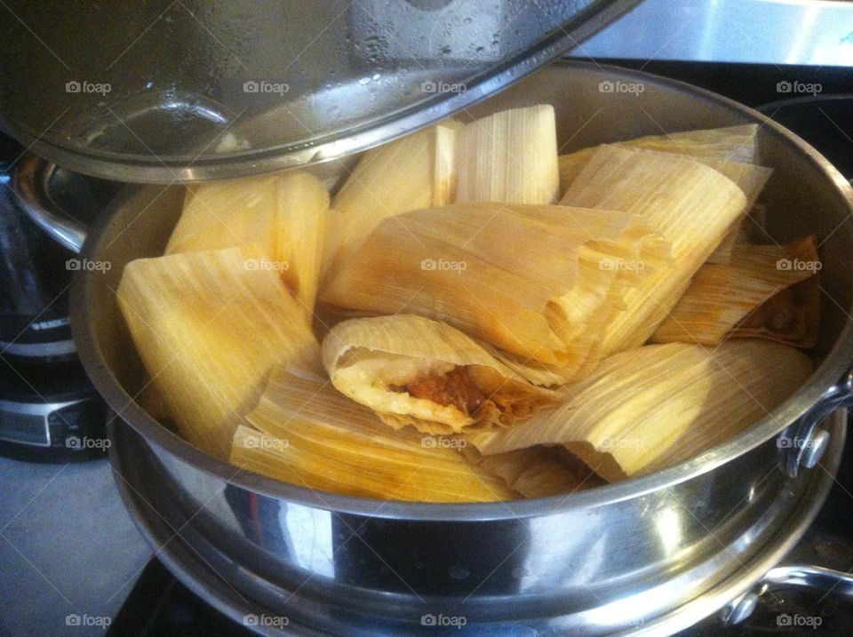 Tamales in a pot cooking.