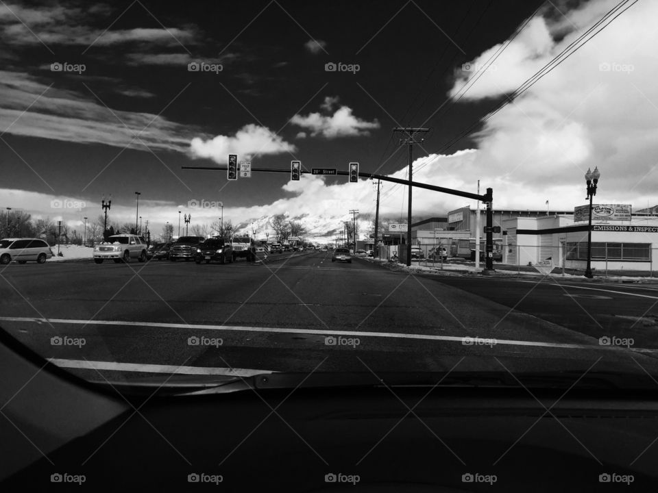 Beautiful Ogden Utah from inside the car at a stop light. Big puffy clouds and the black and white contrast make the photo pop. 