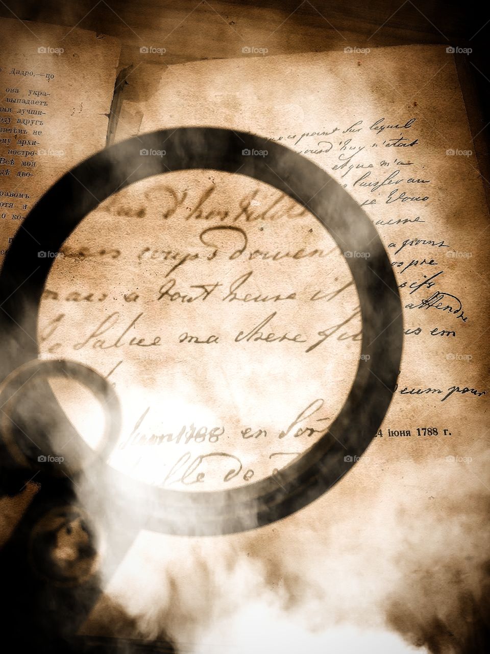 The magnifier is aimed at the font of the old book.  Book in the haze