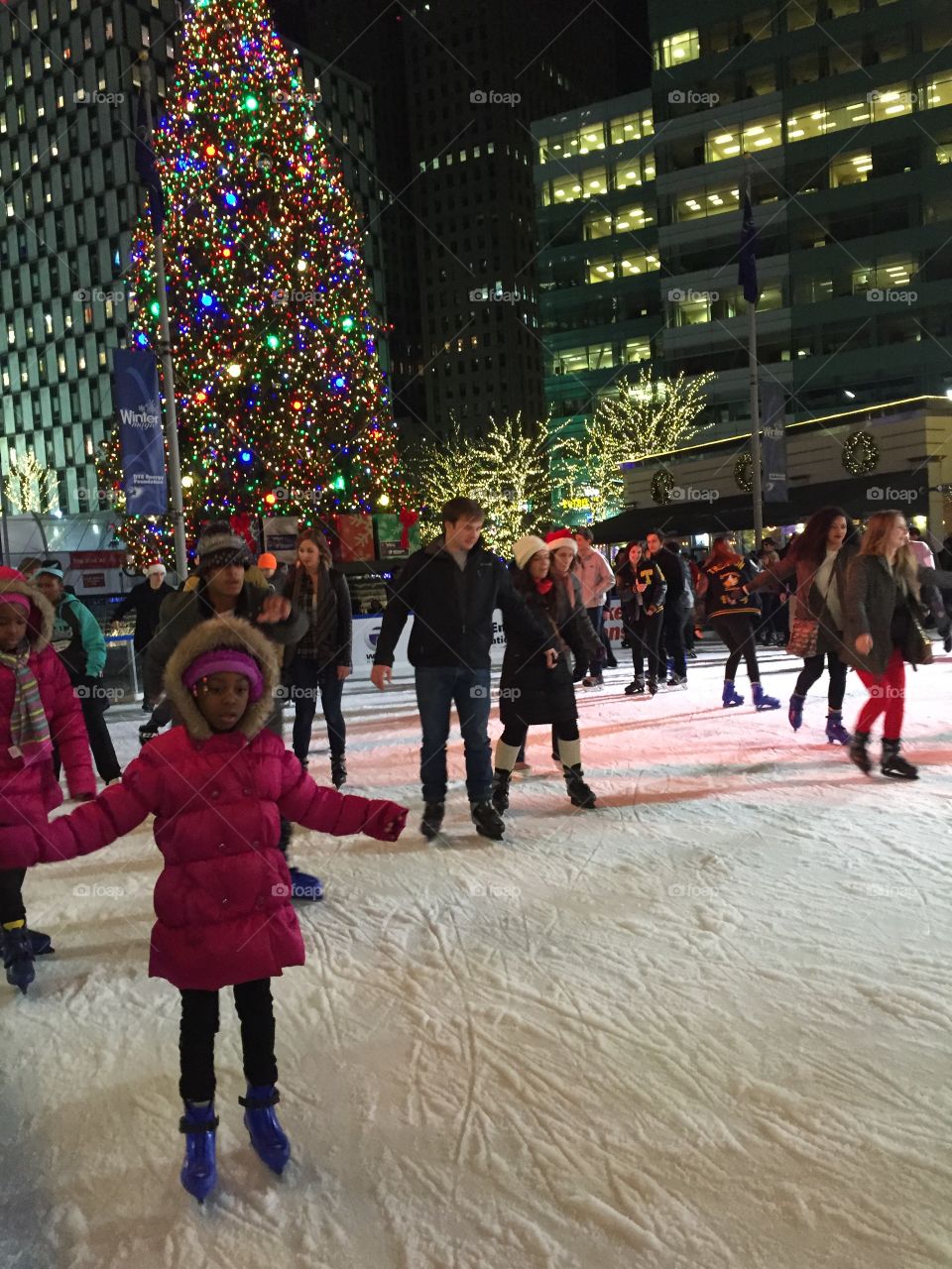 People enjoying ice skating during winter