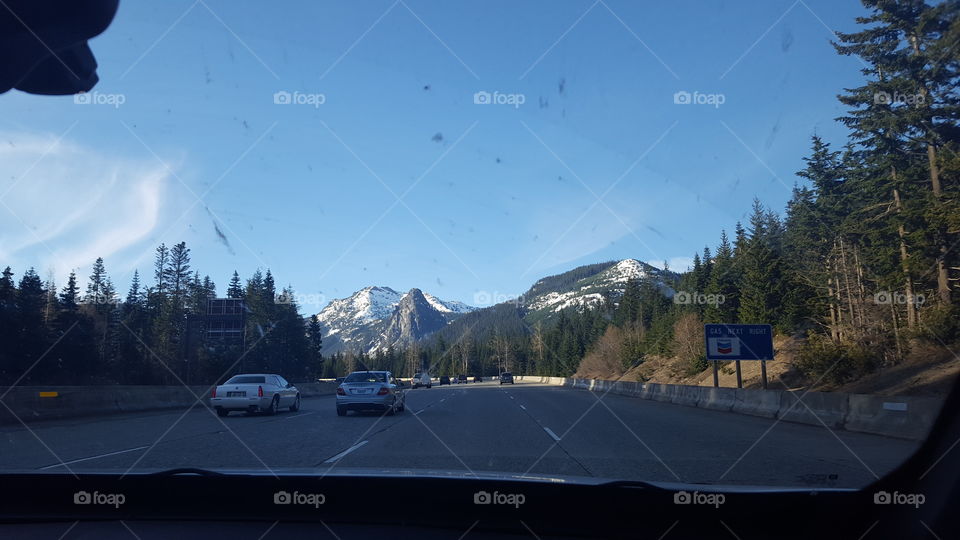 Sunny mountain pass through a windshield