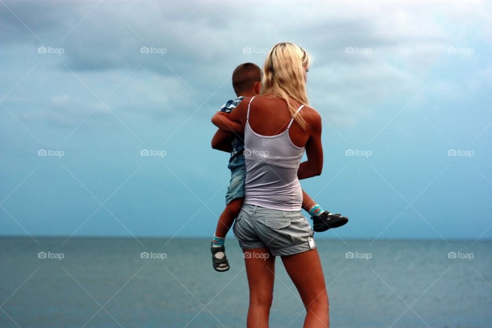 Mother with child at the beach