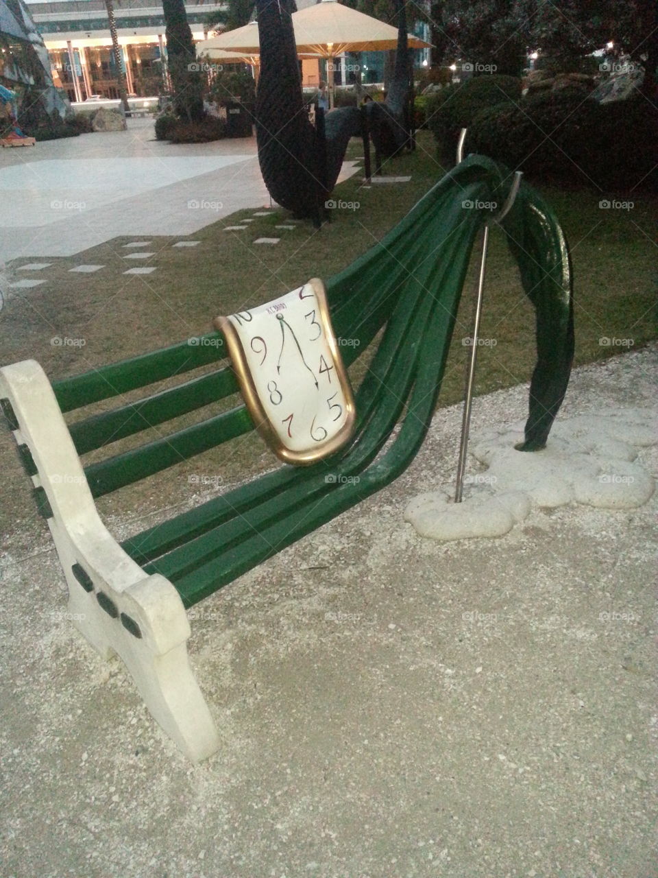 This is a park bench at the Salvador Dali Museum showing the melting clock.