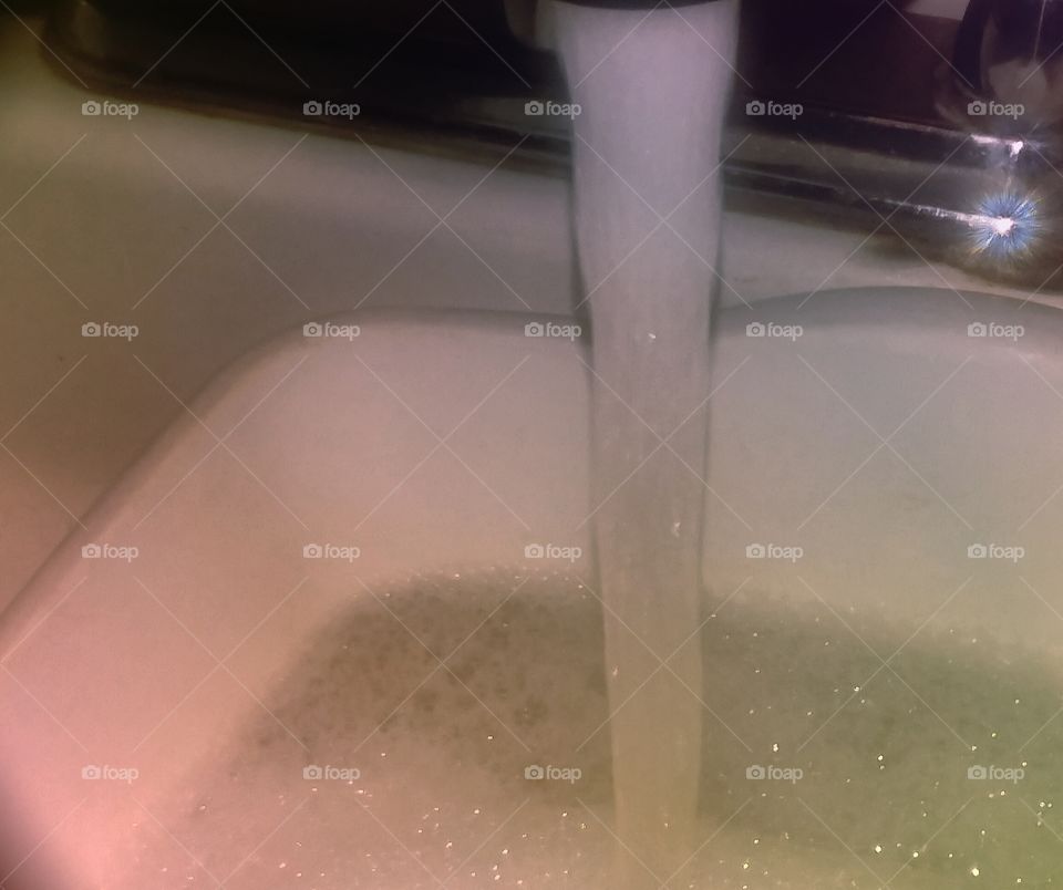 Faucet Running into Basin (Dishwasher)