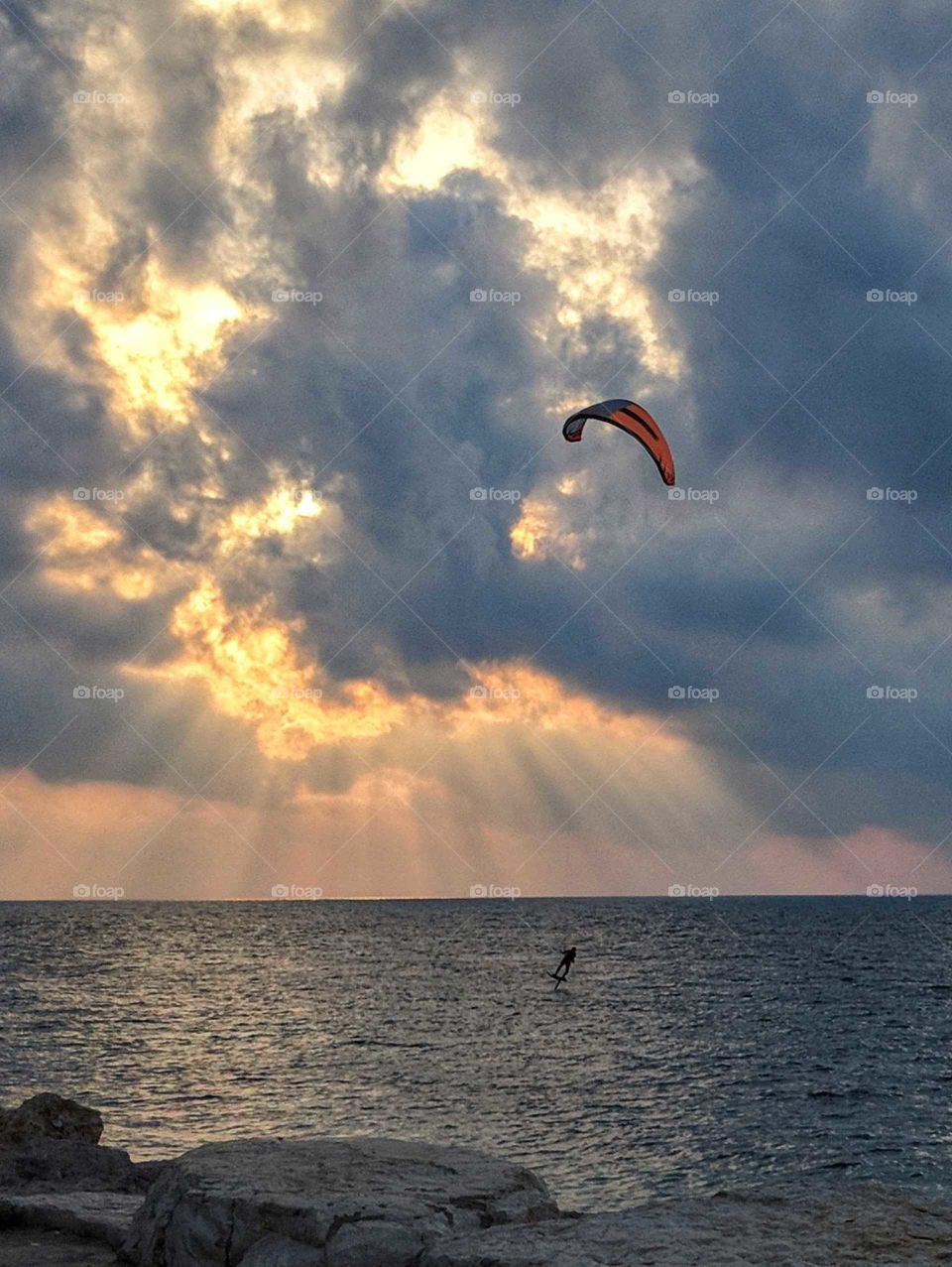 kitesurf recreational activity at sunset
