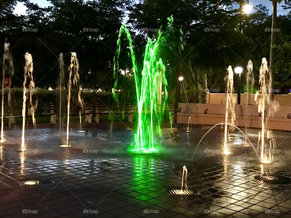 Water fountain with green lit center spout