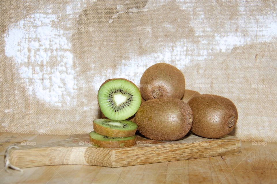 Kiwi fruits on cutting broad