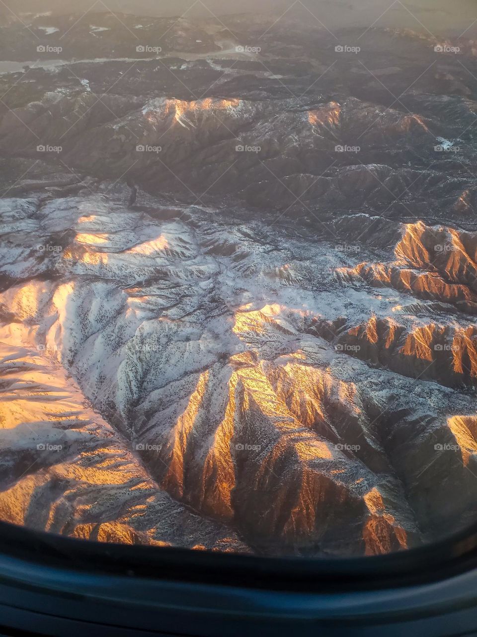Snow capped California mountains seen from several thousand feet one winter morning