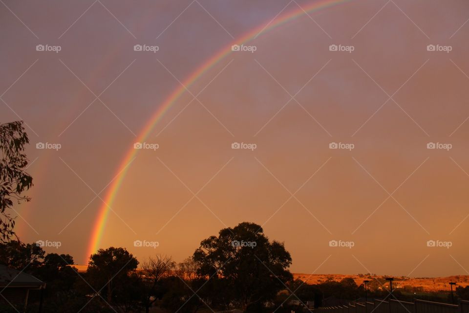 Afternoon rainbow lighting up the sky