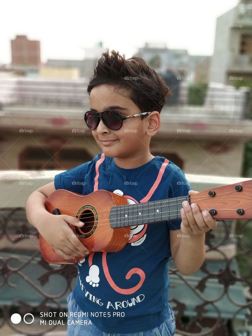 Indian boy playing guitar