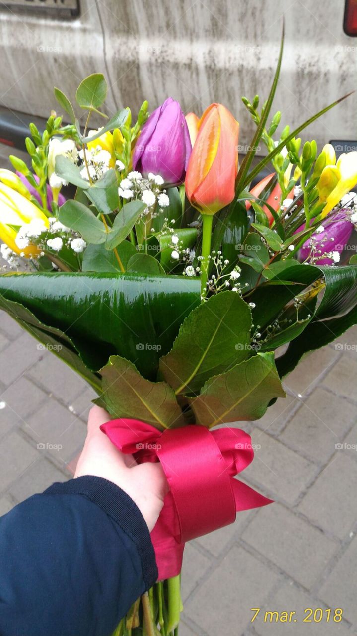 Woman holding a bouquet of flowers