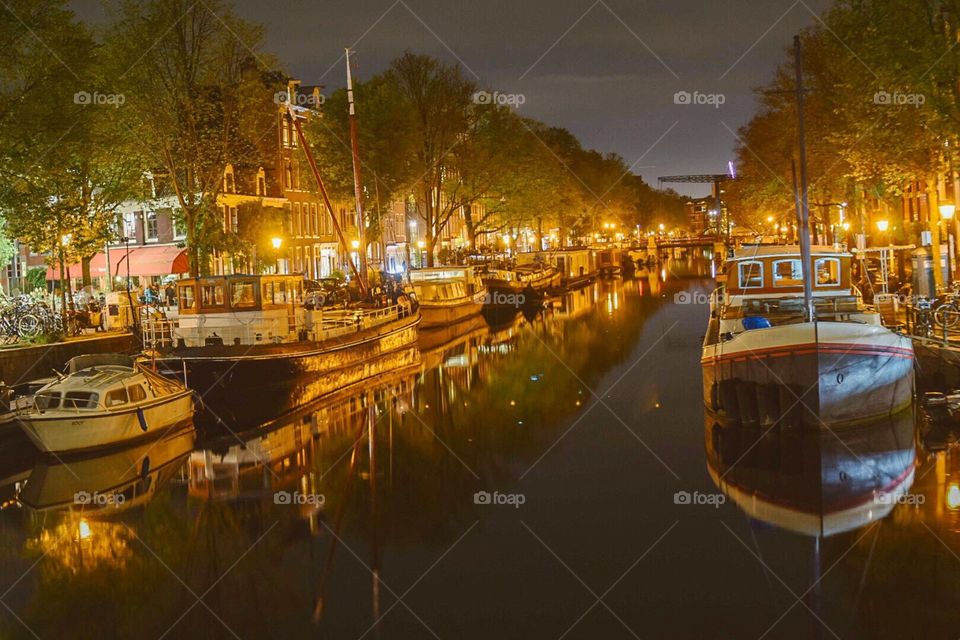Amsterdam at night and Boat Reflection 