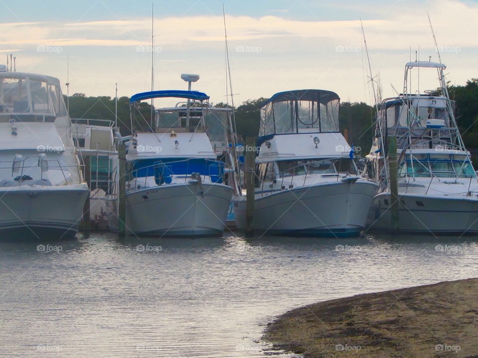 Boats , water, dock, bay , sky 