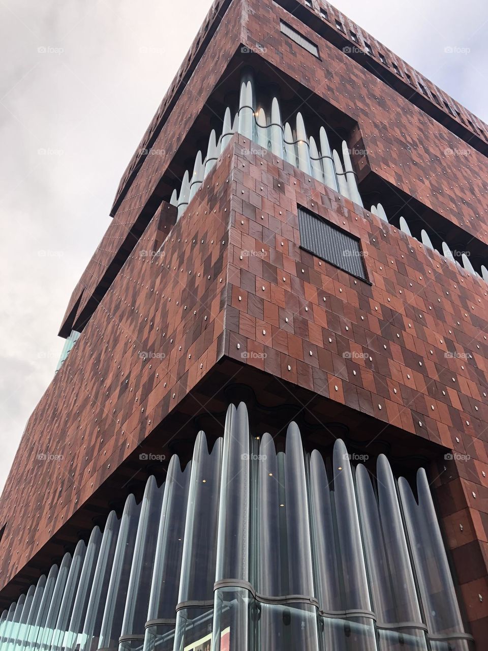 Modern building facade with glass window in curves