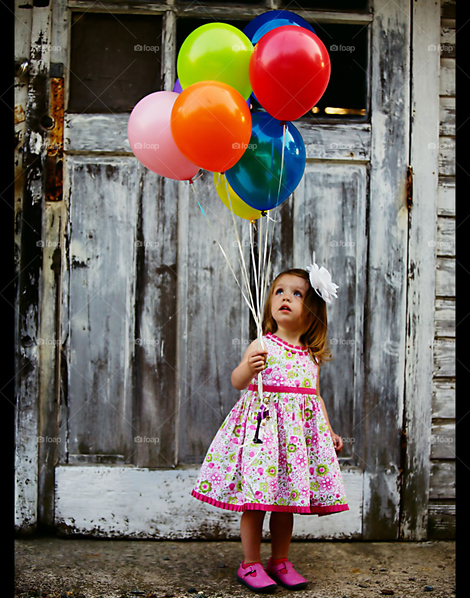 Gracie and her balloons. My daughter at two-years-old playing with balloons.