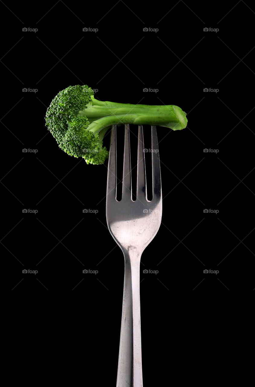 fresh green broccoli on a fork