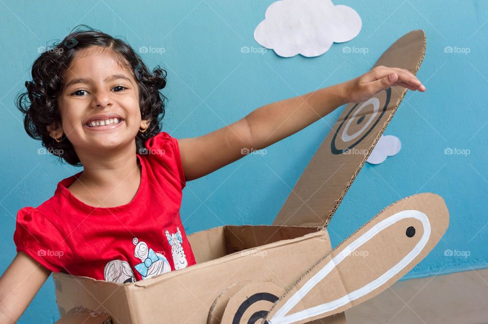 Waste cardboard box aeroplane toy for children.