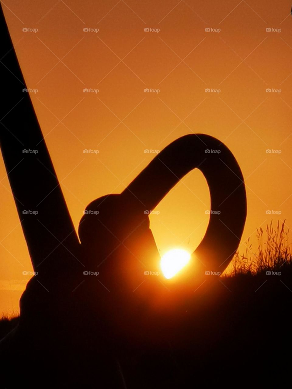 Sunset through a ships anker