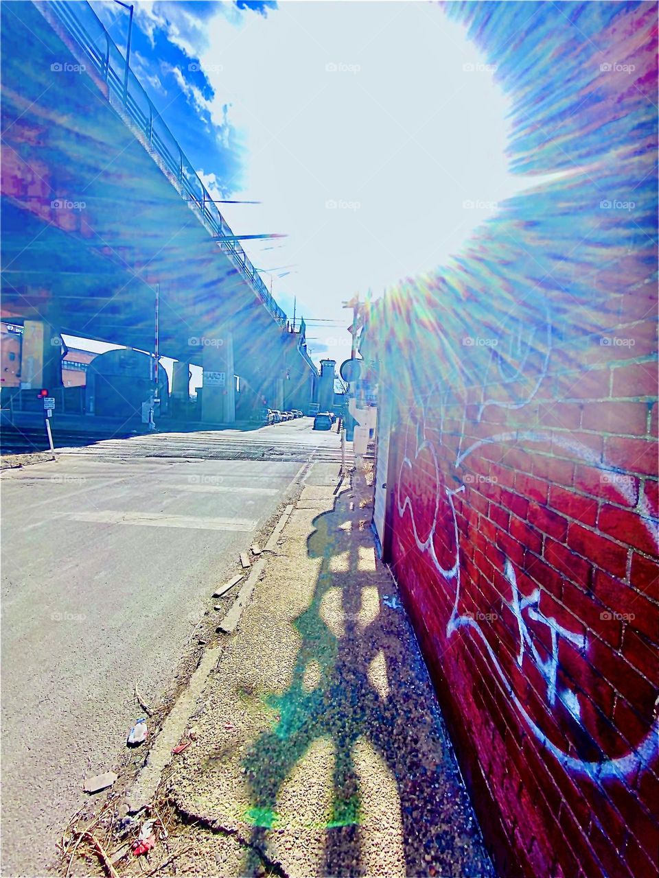 An amazing lens flare formed this afternoon today while walking back to our boat, the “Salvation” passing through the parking lot beneath the Pulaski Bridge at Newtown Creek in LIC, Queens, NY and crossing the train tracks. 2022. Hypnotic Productions