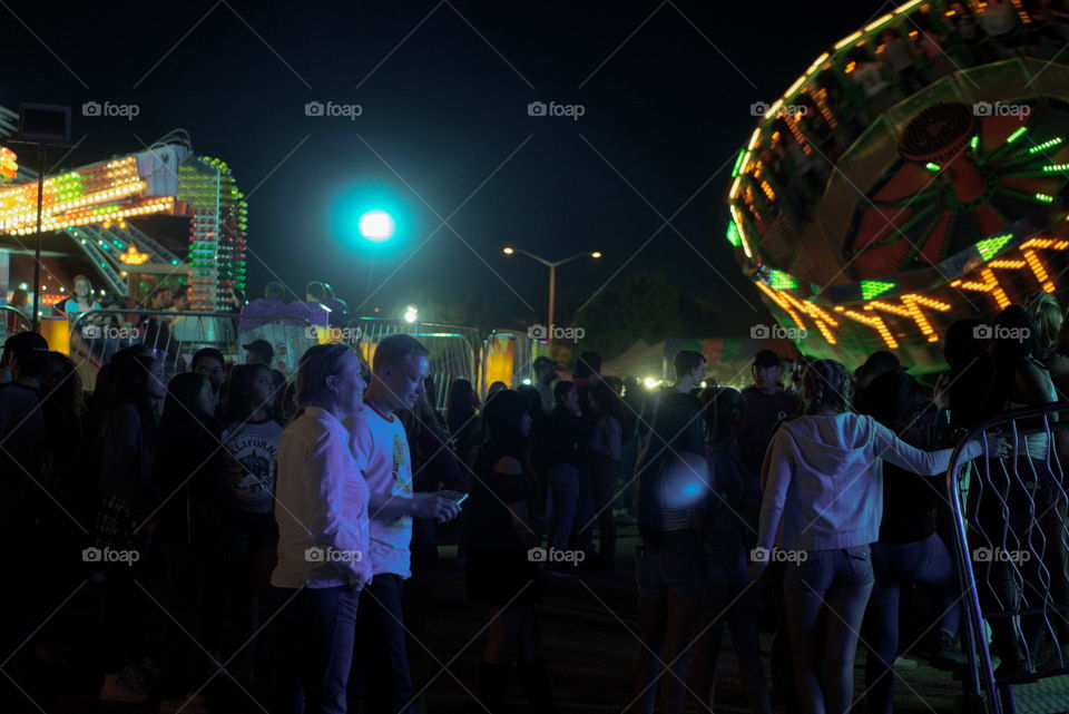 carnival ride night light swirling colors time lapse long exposure colorful fun people summer