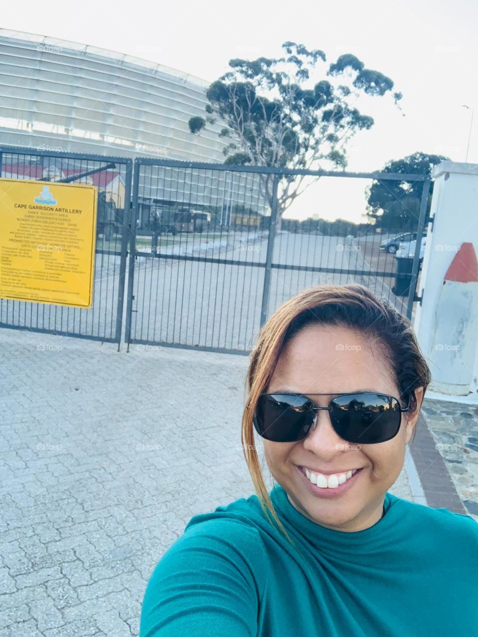 Smiles in front of stadium 