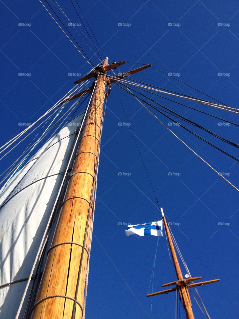 The masts. Sail ship masts and finnish flag