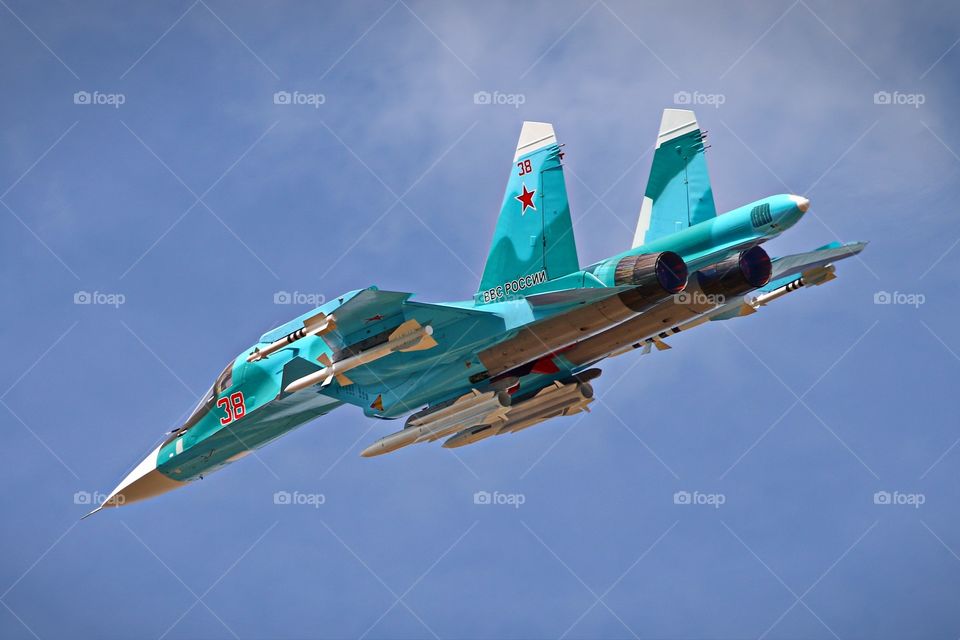 Fully armed Su-34 Fullback. Russian air force Sukhoi Su-34 Fullback in the air fully loaded with weapons and ready to attack.