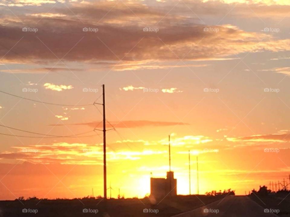Western Kansas sunset with a grain elevator. 