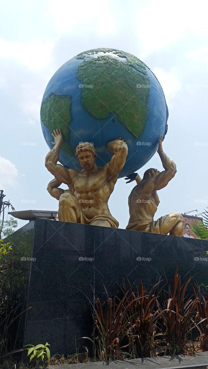 status of a three human carrying globe as their own place to live.