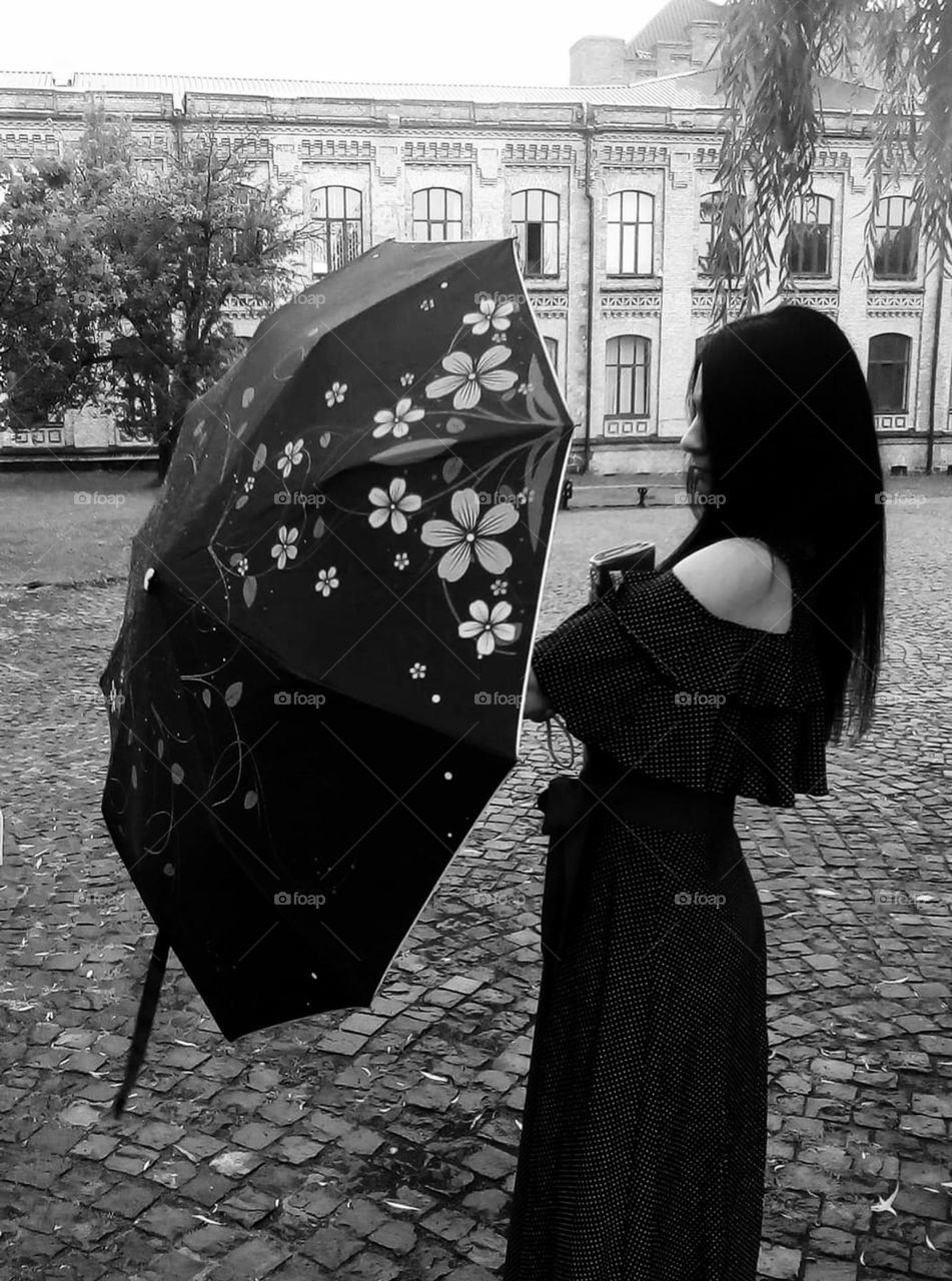 a girl with an umbrella in black