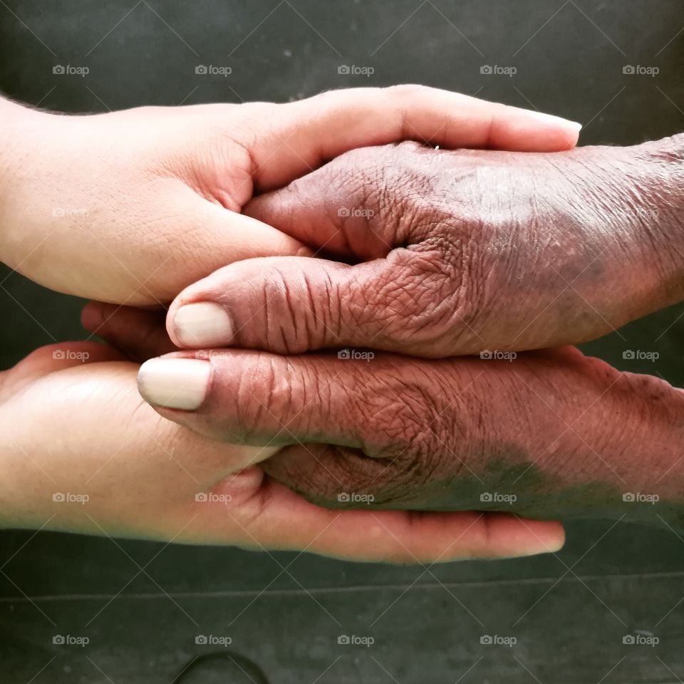 Granddaughter and grandmother holding hands