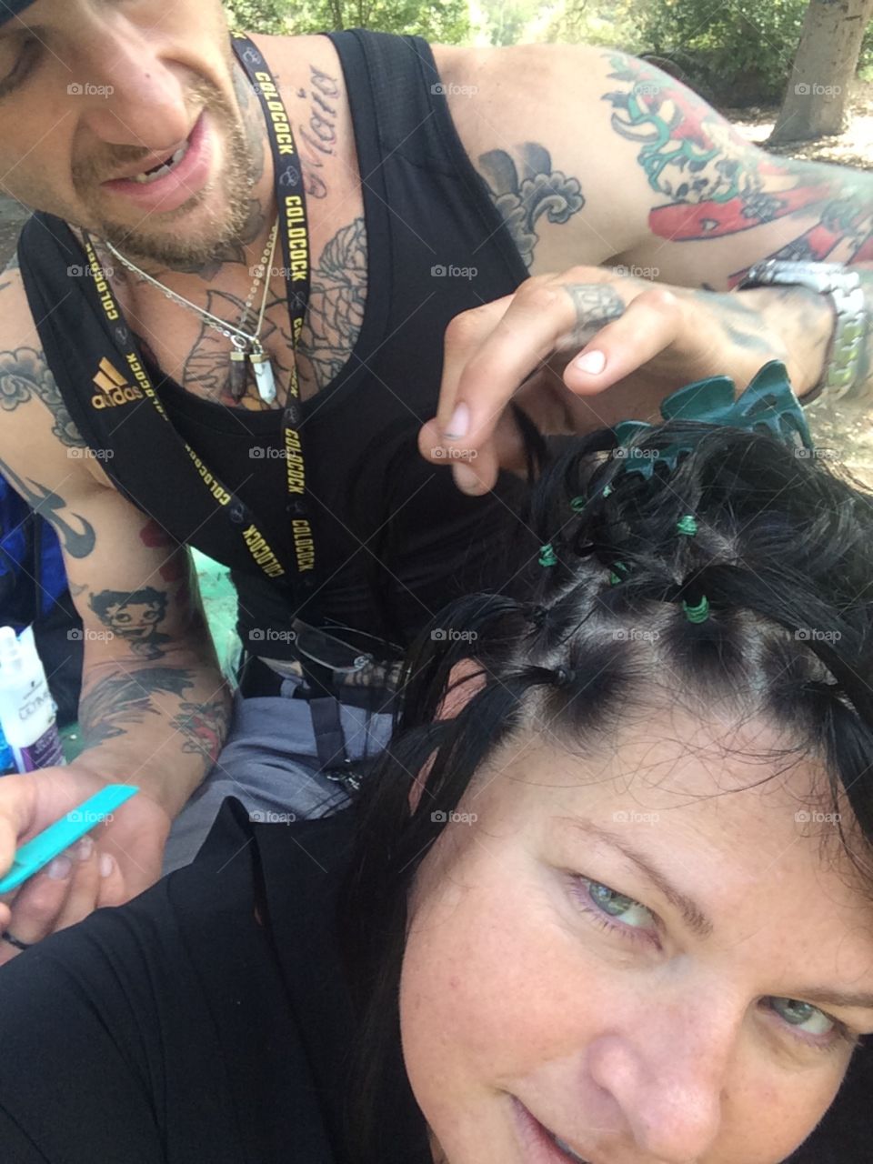 Boyfriend braiding hair balboa park in San Diego 