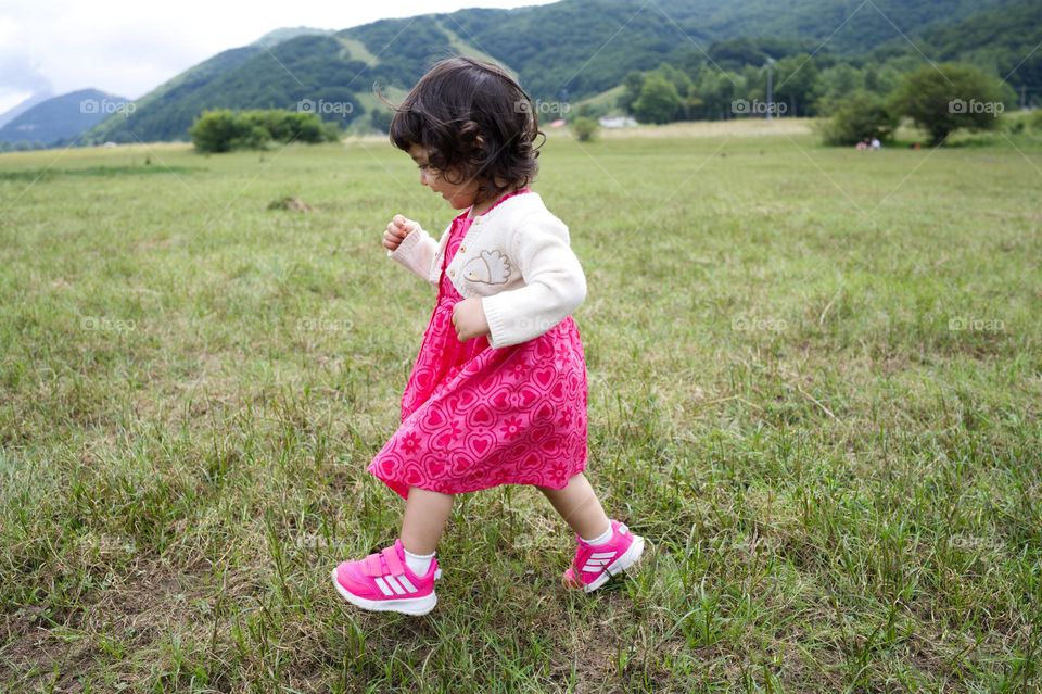 running in the grass in summer