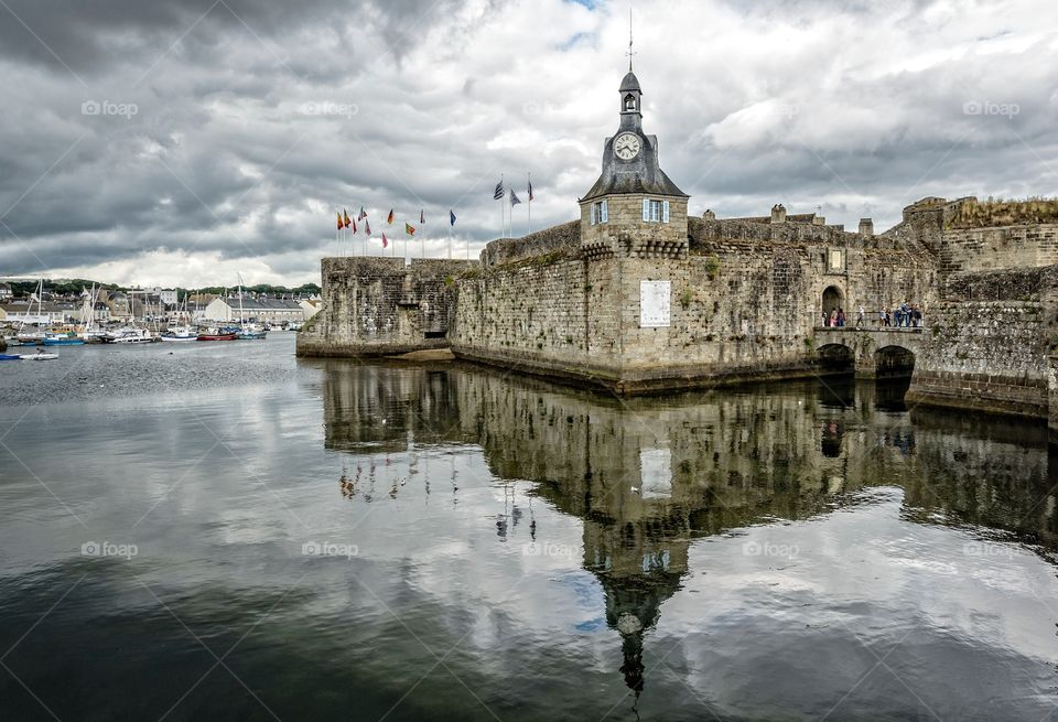 French medieval fortress reflected in the water