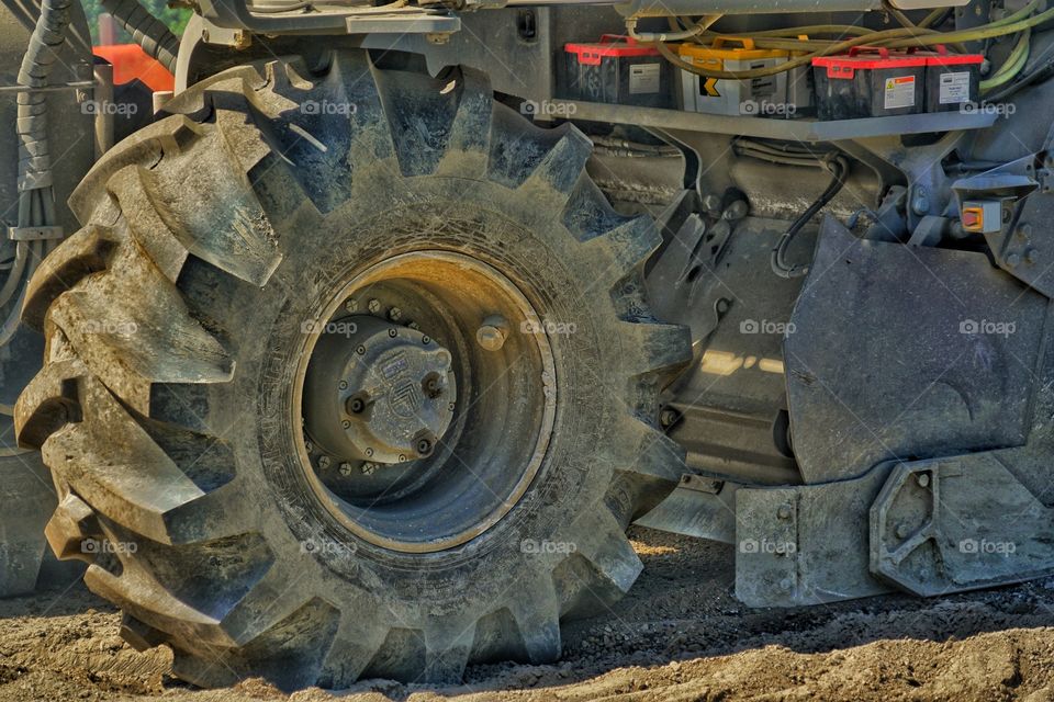 Giant Tires And Batteries On Heavy Construction Vehicle