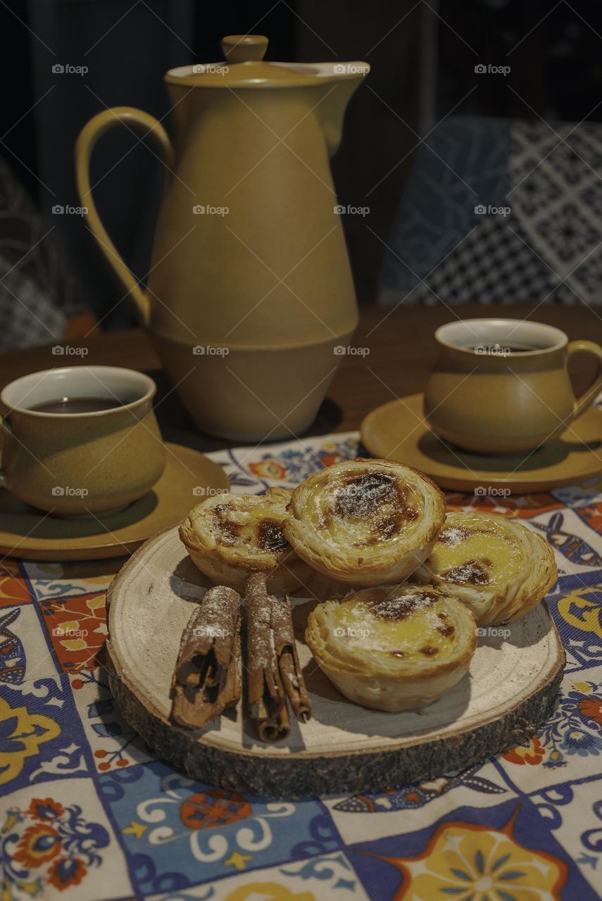Homely coffee and pastéis de nata with vintage crockery