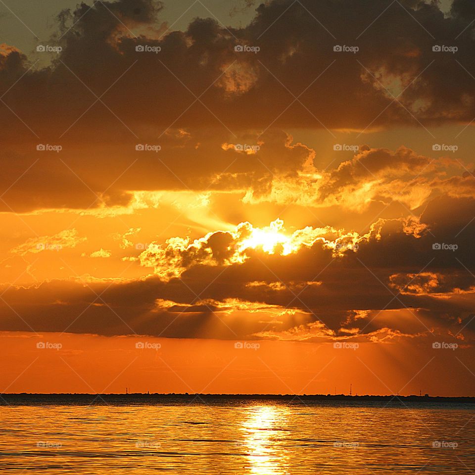 The sky erupted in spectacular golden hues of orange moments before the sun sunk below the horizon giving the viewers a fabulous and unforgettable sunset