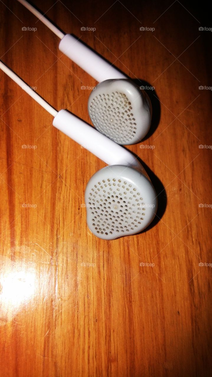 earphone on wooden table