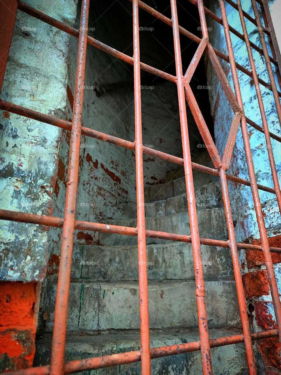Rectangles.  An iron door with rectangular openings closes the entrance to the old staircase of the old tower